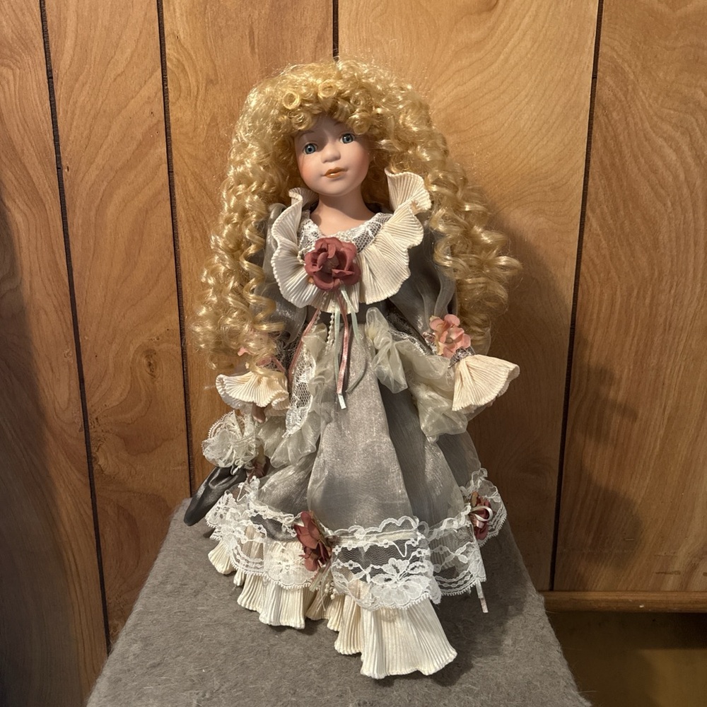 Charming Gray and Cream Porcelain Doll with Floral Details